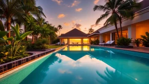 Villa management phuket showcasing a luxury villa with a stunning sunset and tropical landscaping.