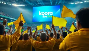Fans celebrating during a soccer match with "Koora live" displayed on screen, showcasing excitement and sportsmanship.